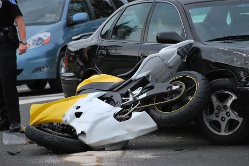 damaged motorcycle after car accident